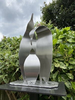 Stainless steel sculpture of a family of Emperor penguins