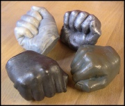 Fist  - cast in various materials - Clockwise Aliminium, Bronze, Iron, Marble