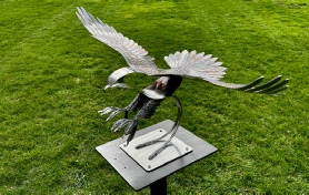 Fish Eagle sculpture on a metal stand