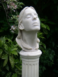 Breath-taking - life size portrait head in marble resin on stone column (close up)