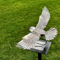 Fish Eagle sculpture on a metal stand